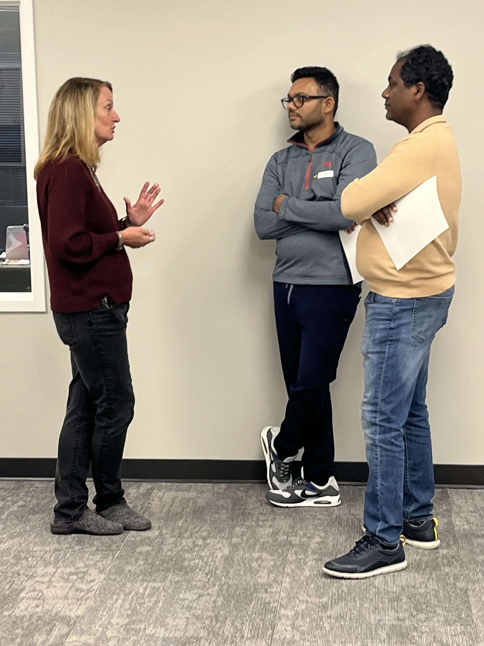 An Academy instructor discusses training with two class participants