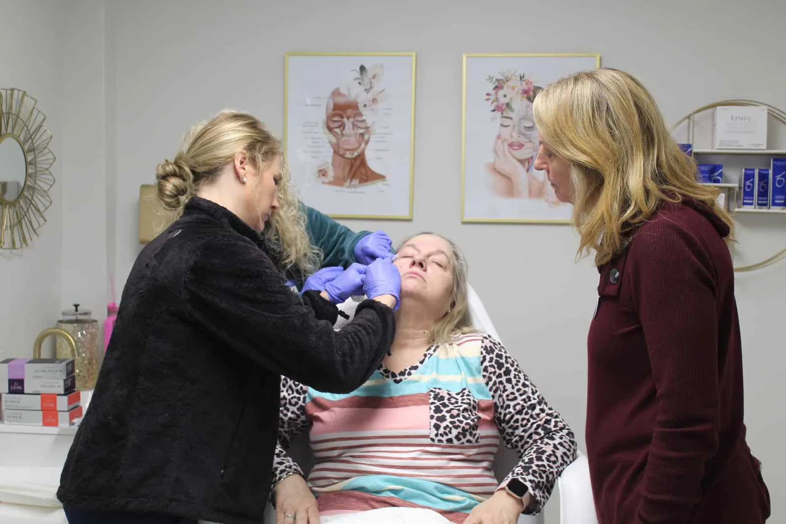 A participant works with a seated model while an instructor watches in Savannah